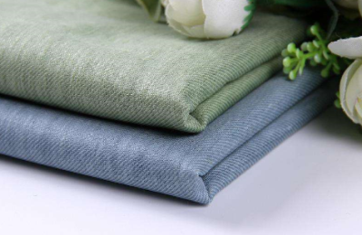 What are the advantages and disadvantages of cotton and linen fabrics?